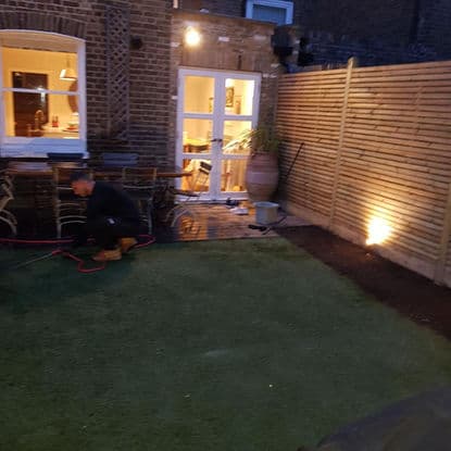 Landscaped garden with new turf and planted borders in South London